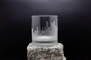 a glass sitting on top of a rock