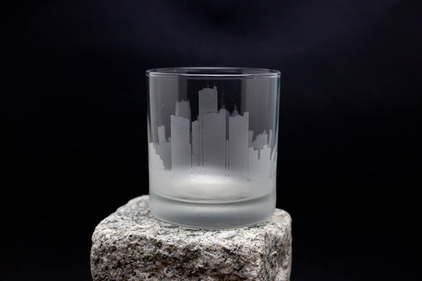 a glass sitting on top of a rock