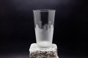 a glass sitting on top of a rock