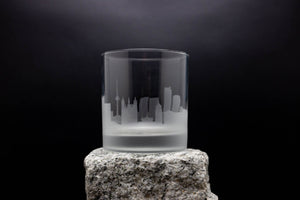 a glass sitting on top of a rock