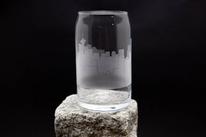 a glass sitting on top of a rock