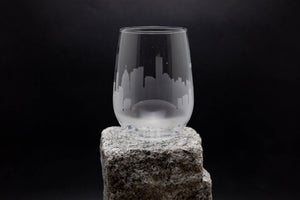 a glass sitting on top of a rock