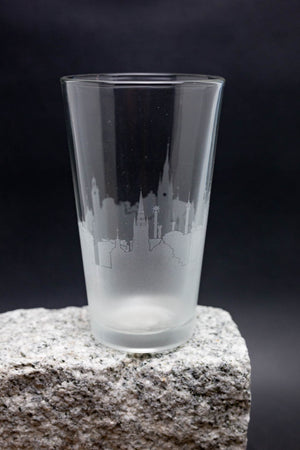 a shot glass sitting on top of a rock