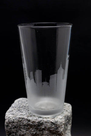 a glass sitting on top of a rock