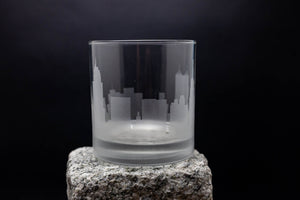 a glass sitting on top of a rock