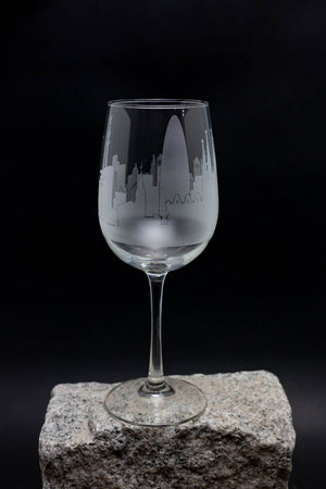 a wine glass sitting on top of a rock