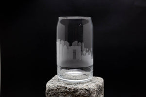 a glass sitting on top of a rock