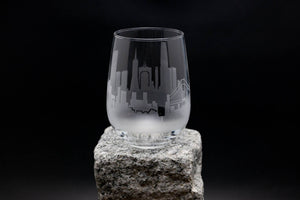 a glass sitting on top of a rock