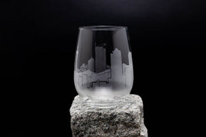 a glass sitting on top of a rock