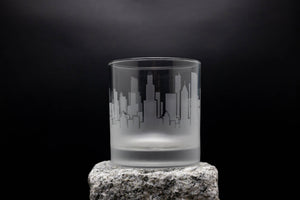 a glass sitting on top of a rock