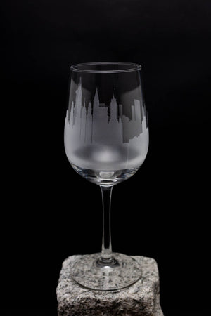 a wine glass sitting on top of a rock