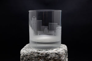 a shot glass sitting on top of a rock