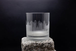 a glass sitting on top of a rock