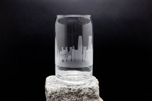 a clear glass sitting on top of a rock