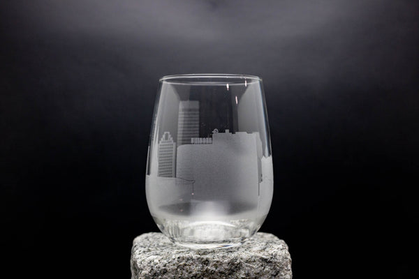 a glass sitting on top of a rock