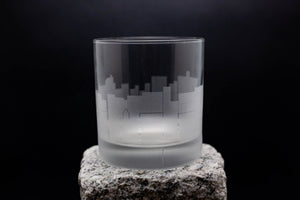 a glass sitting on top of a rock