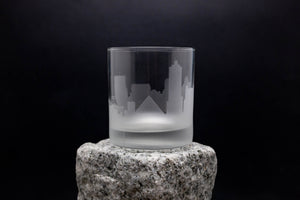 a glass sitting on top of a rock