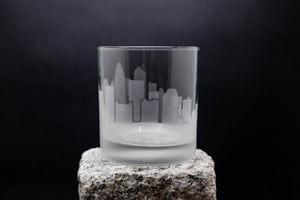 a glass sitting on top of a rock