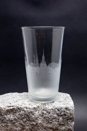 a shot glass sitting on top of a rock