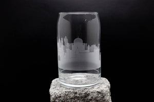 a glass sitting on top of a rock