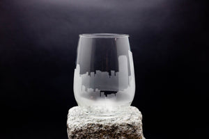 a glass sitting on top of a rock