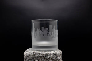 a glass sitting on top of a rock