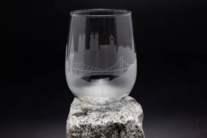 a glass sitting on top of a rock