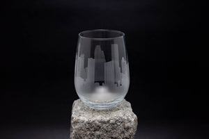 a glass sitting on top of a rock