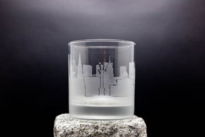 a glass with a picture of a city on it