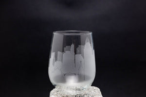 a glass sitting on top of a rock