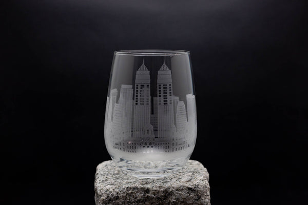 a glass with a building etched on it