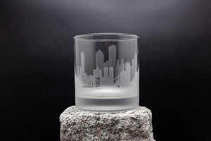 a clear glass sitting on top of a rock