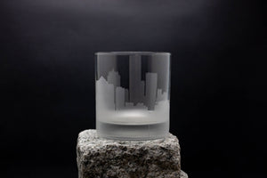 a glass sitting on top of a rock