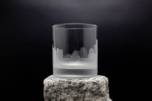 a glass sitting on top of a rock