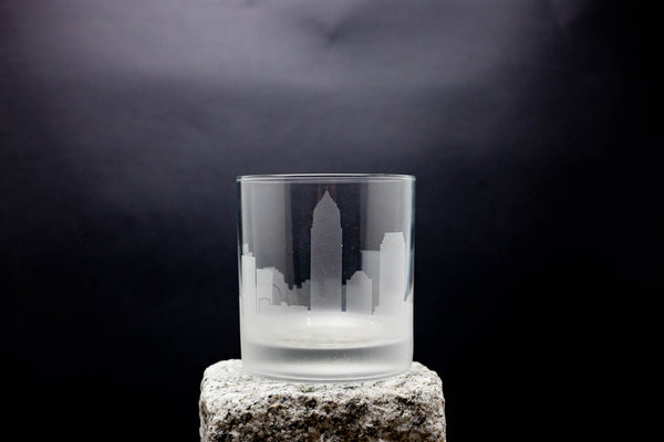 a glass sitting on top of a rock