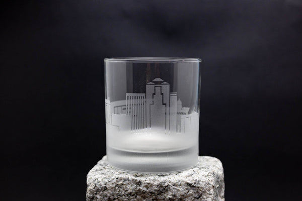 a shot glass sitting on top of a rock