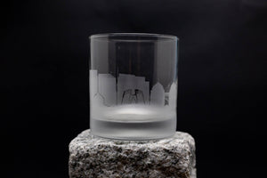 a shot glass sitting on top of a rock