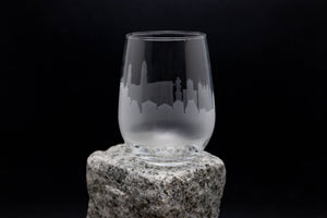 a glass sitting on top of a rock