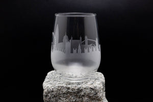 a glass sitting on top of a rock