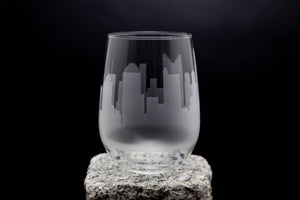 a glass sitting on top of a rock