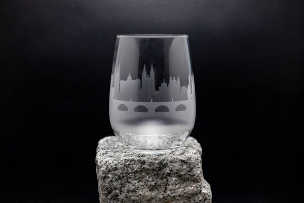 a glass sitting on top of a rock