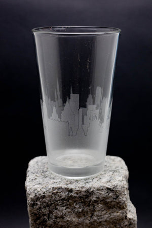 a glass sitting on top of a rock