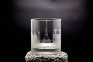 a glass with a picture of the eiffel tower on it