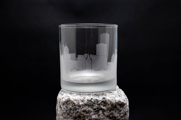 a glass sitting on top of a rock