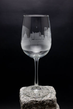 a wine glass sitting on top of a rock