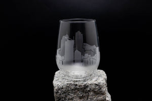 a glass sitting on top of a rock