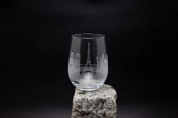 a glass sitting on top of a rock