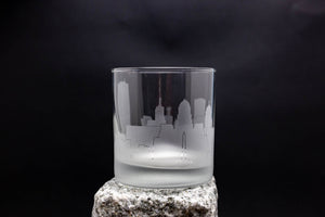 a shot glass sitting on top of a rock