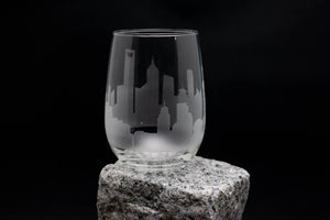 a glass sitting on top of a rock