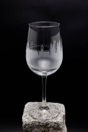 a wine glass sitting on top of a rock